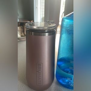 Brumate tumbler with hinged lid. Next to 1 liter Nalgene for reference